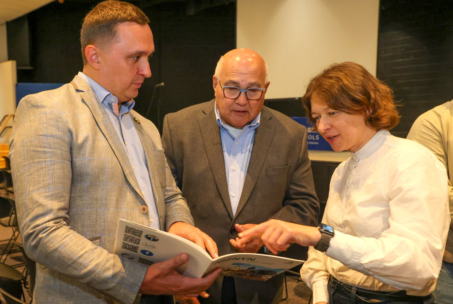 From left:: Ruslan Kaidash, commissioner of Ukraine's national energy and utilities regulatory commission; Framingham Mayor Charles Sisitsky; and Olena Pavlenko, president of Ukrainian NGO DiXi Group, discussed the geothermal pilot during a site tour in Framingham.