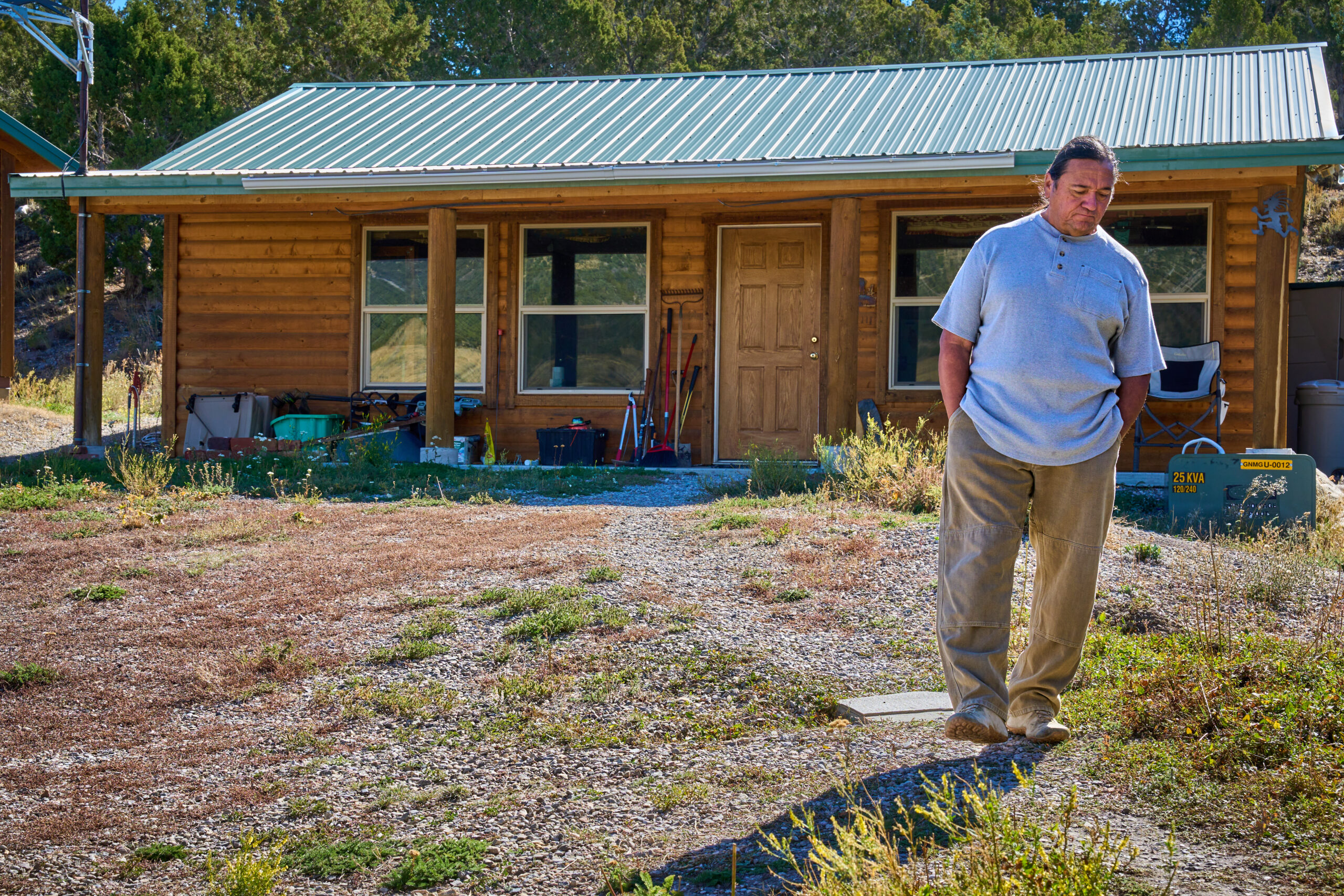 Rich Spilsbury walks the path between his house and his mother’s house in Ely, Nevada. Credit: Alex Gould/Inside Climate News