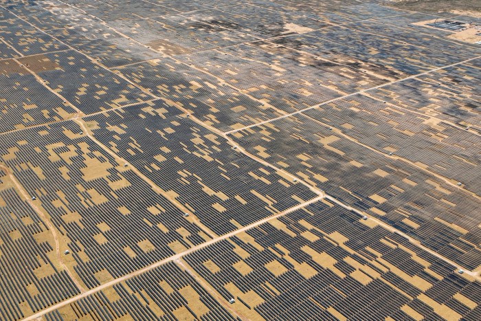 An aerial view shows solar panels at the Ningxia Tengger Desert New Energy Base in Zhongwei, in China’s northern Ningxia region