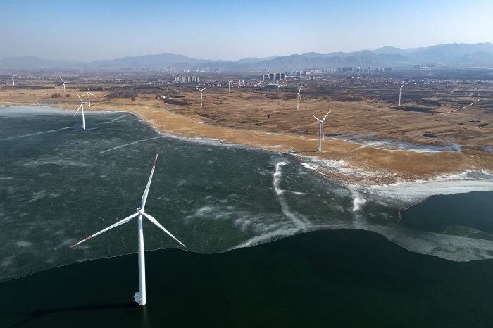 Wind turbines operated by Beijing Energy Group Co. in the outskirts of Beijing, China