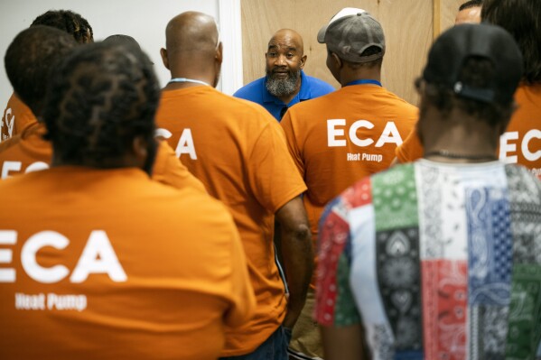 Jackie Robinson, an instructor at the Energy Coordinating Agency, a nonprofit focused in part on energy equity, works inside the facility on Tuesday, July 2, 2024 in Philadelphia. (AP Photo/Joe Lamberti)