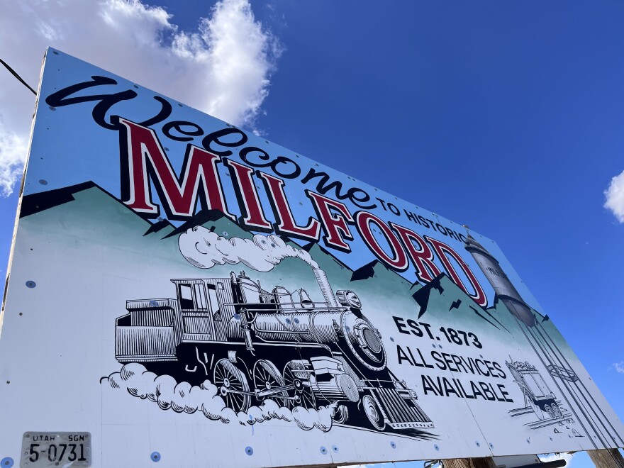 A sign welcomes visitors to Milford with an image of a locomotive, Aug. 13, 2024. The town lost many of its railroad jobs in recent decades but hopes renewable energy can create a sustainable economic future.