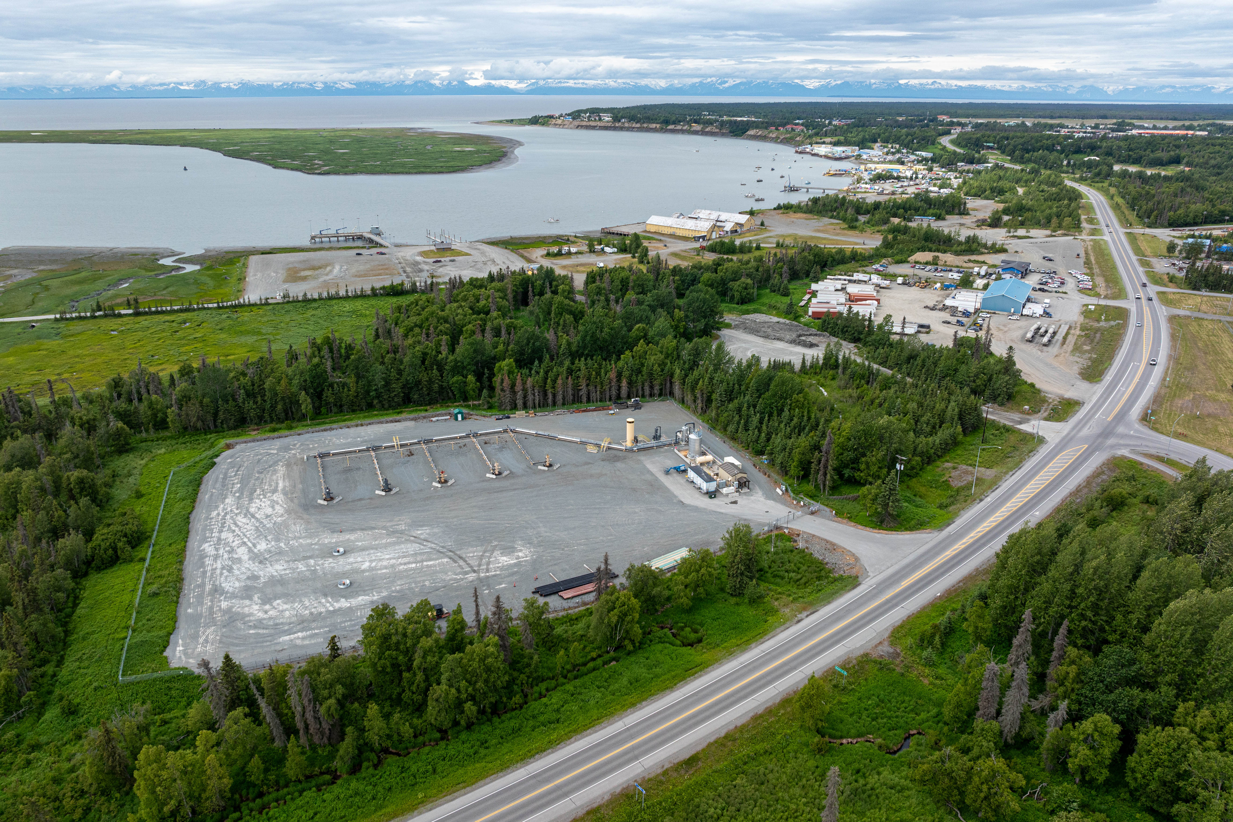 Two new wells are prepared for drilling at the Cook Inlet Natural Gas Storage Alaska facility on July 1 in Kenai. The facility takes natural gas from producers and stores the gas underground in a depleted gas field until it is needed by its customers. Proponents of a green hydrogen project hope that depleted gas reservoirs could also be used to store this fuel. Credit: Loren Holmes/ADN