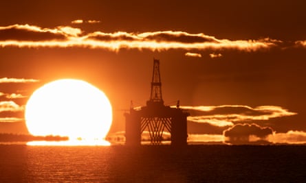 The sun rises behind a redundant oil platform moored in the Firth of Forth near Kirkcaldy, Fife.