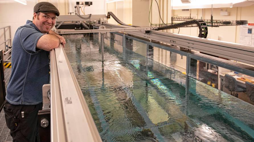 Dana Parsons, the lab manager for mechanical and industrial engineering for the Ocean Resources and Renewable Energy initiative, explains a wave/current flume testing facility that allows researchers to explore wind, wave and tidal energy. The ORRE group is part of the university’s overall renewable energy initiative.