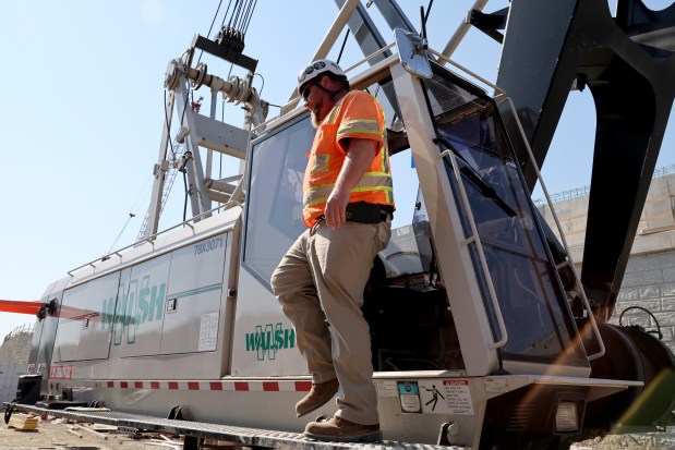 Dale Gilchrist crane operator, and member of the International Union of Operating Engineers workers, on the I-294 expressway in the western suburbs, on Sept. 18, 2024. (Antonio Perez/Chicago Tribune)