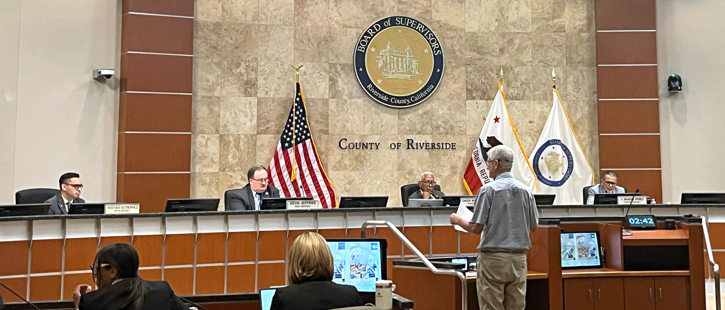 Mark Carrington outlines the mitigation measures the community wants from a proposed solar project during public comment before the Riverside County Board of Supervisors. Credit: Wyatt Myskow/Inside Climate News