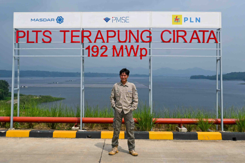 Dimas Kaharudin, the operational director at Cirata Floating Solar, stands in front of the company's sign. Credit: Anna McNulty/Inside Climate News