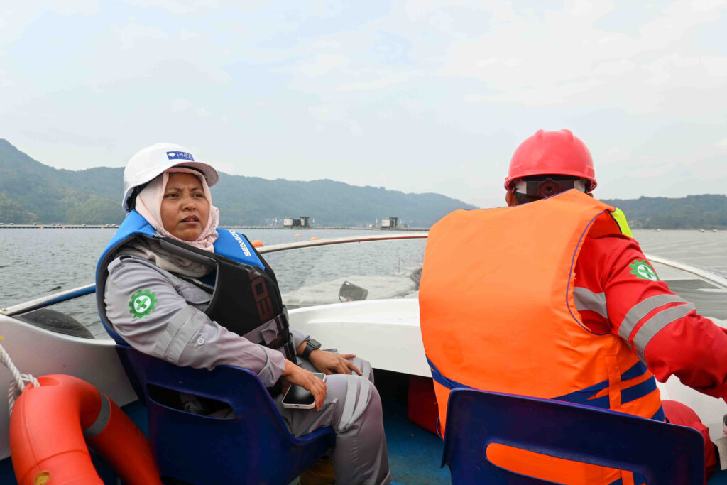 Hesti Aprilianti, a health and safety analyst at Cirata Floating Solar, gives tours of the plant to guests from all over the world each week. Credit: Anna McNulty/Inside Climate News