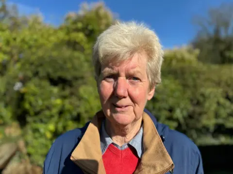 A head-and-shoulders photograph of Jennifer Cooper