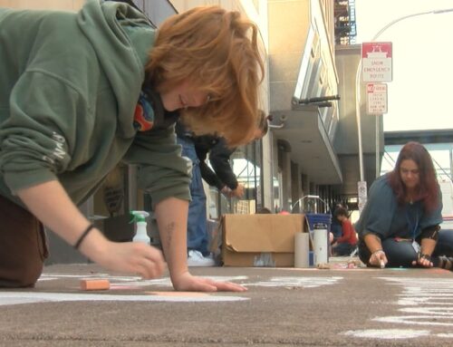 Students advocate for the environment through chalk art in downtown Duluth