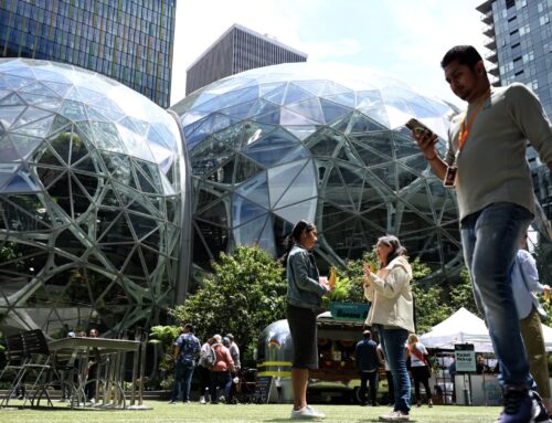 Amazon laying off about 14,000 corporate workers as it invests more in AI