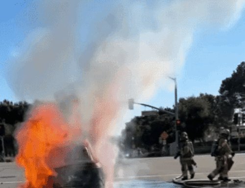 Electric Vehicle Erupts in Flames at Busy Intersection