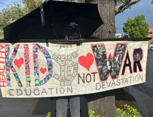 Eugene Tax Day protesters urge shifting military spending to community and environment